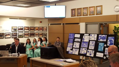 Student presentation at Hanover School Division office.