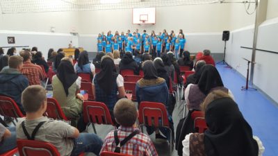 Choir performing in gymnasium